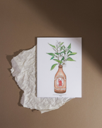 Lámina Botellín Cruzcampo con flores de azahar