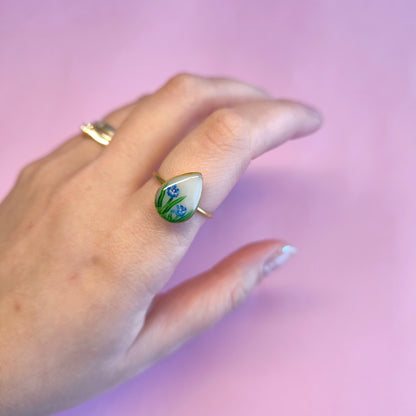 Anillo gota con flores azules (dorado)