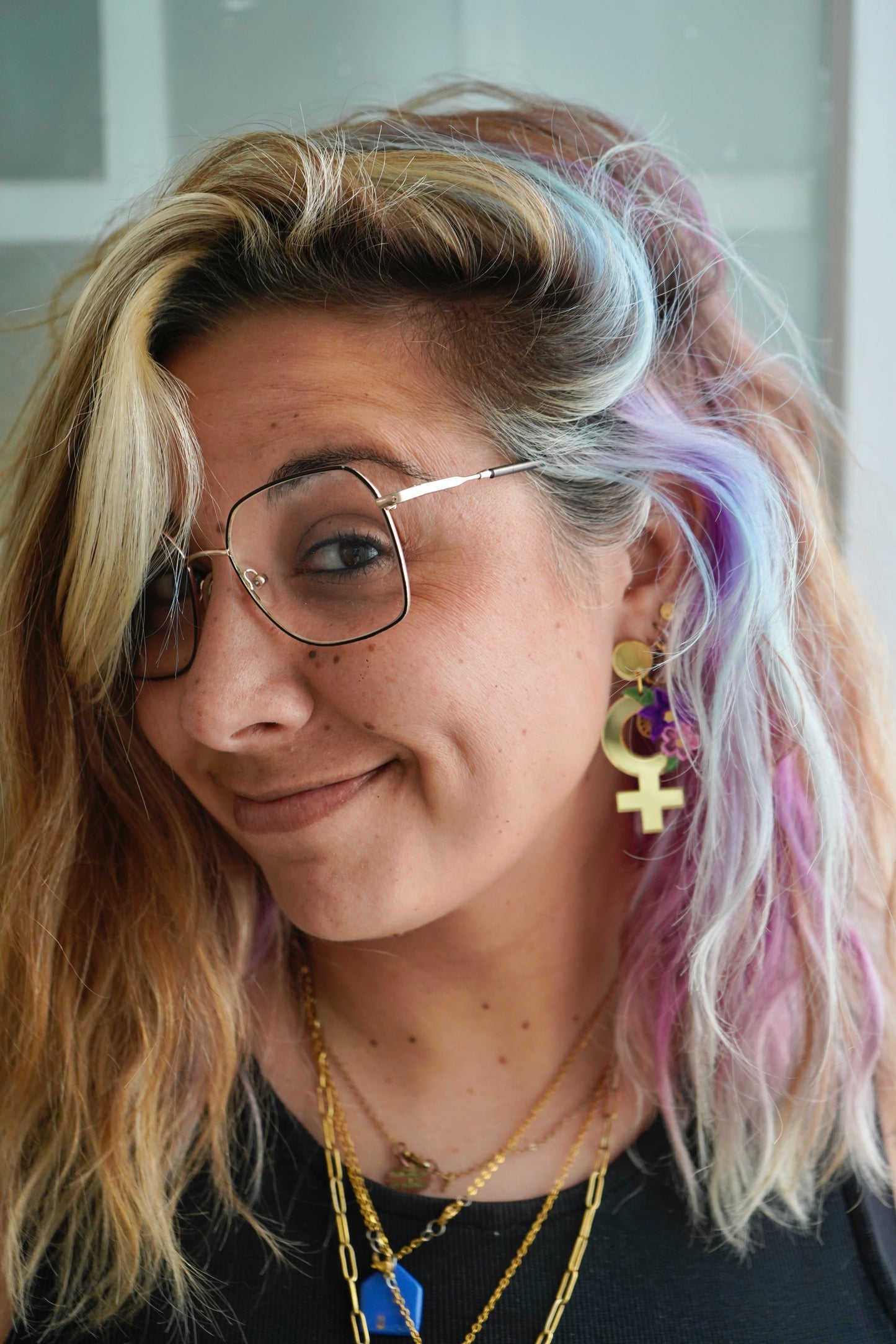 Pendientes símbolo de la mujer