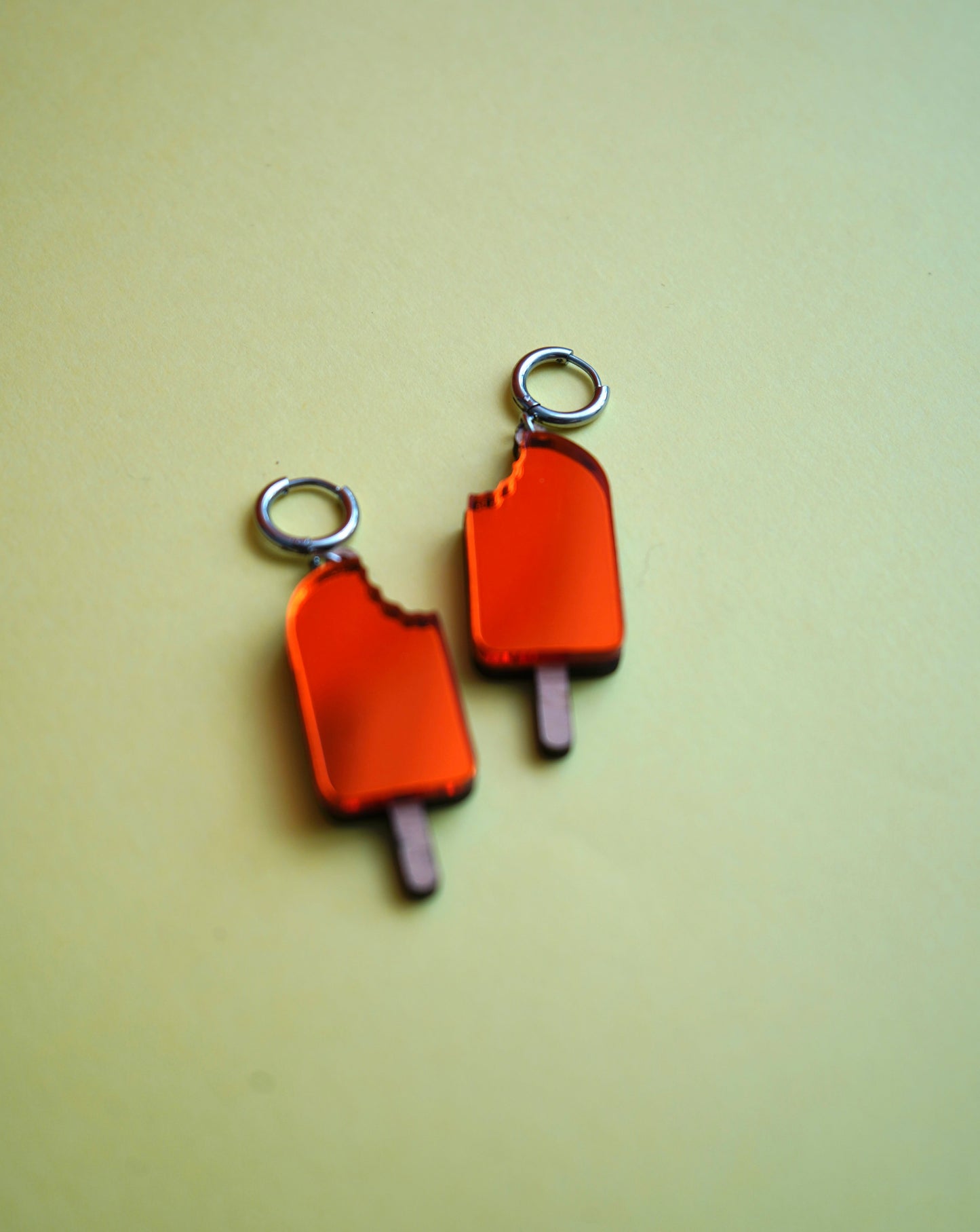 Pendientes polo naranja helado