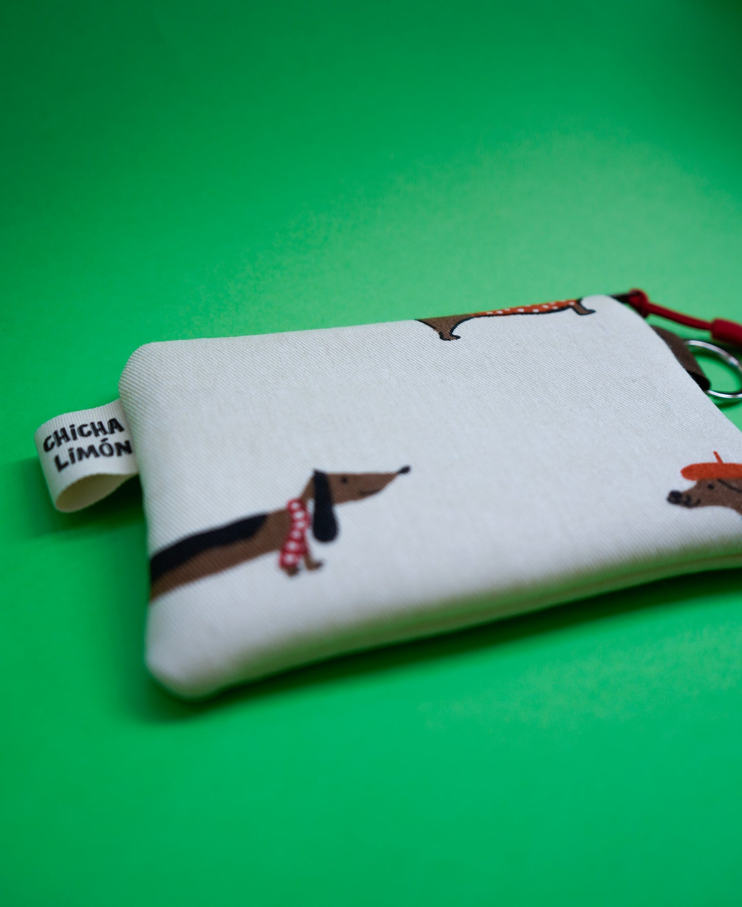 Monedero perros salchicha gorritos