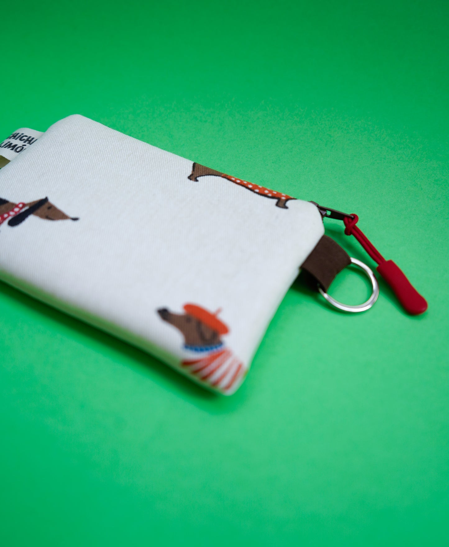 Monedero perros salchicha gorritos