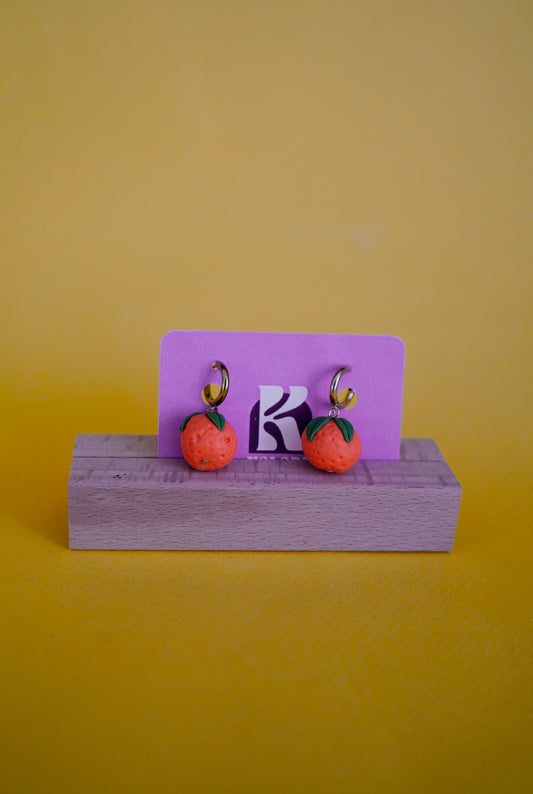 Pendientes de naranjas
