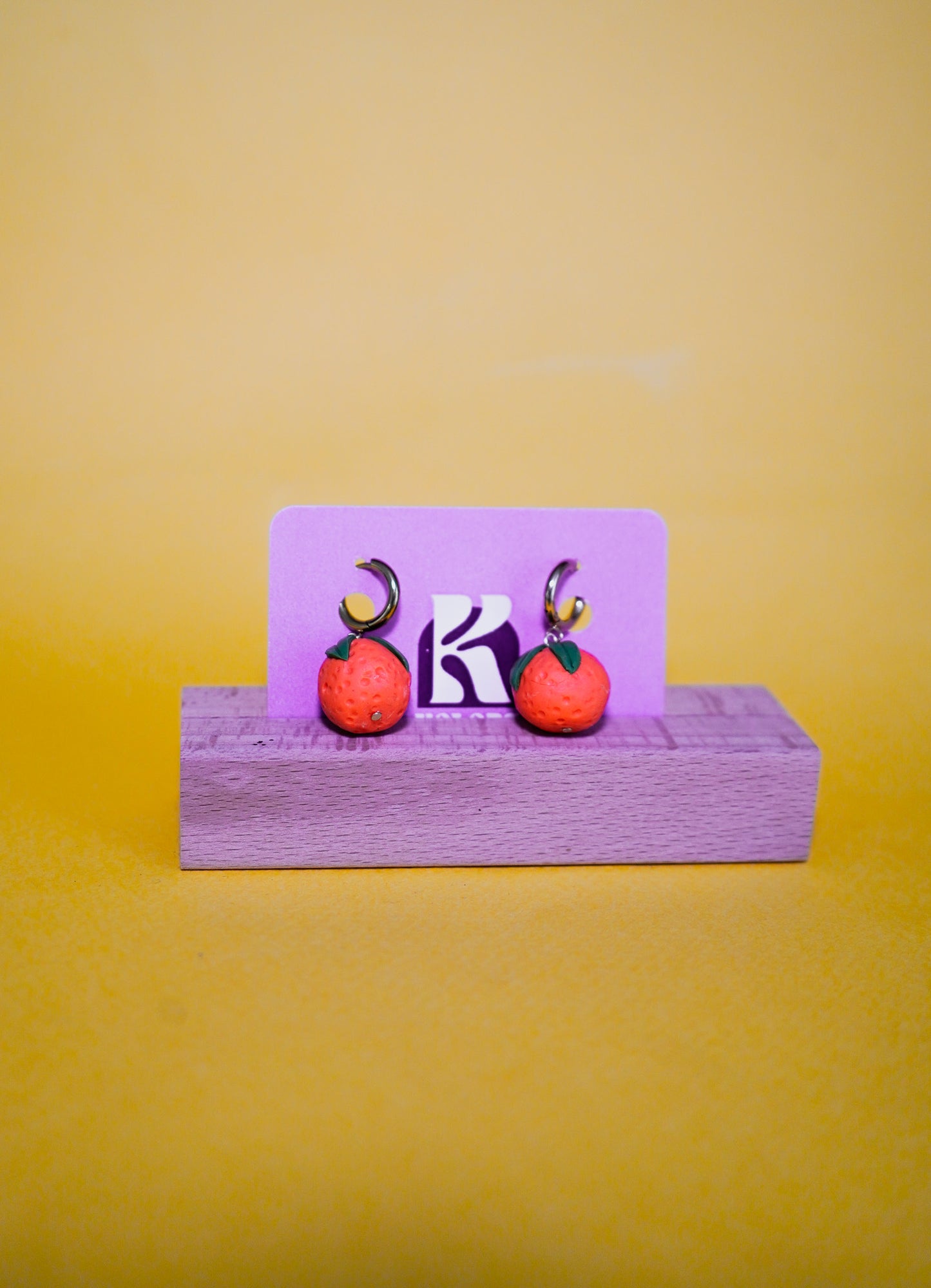 Pendientes de naranjas