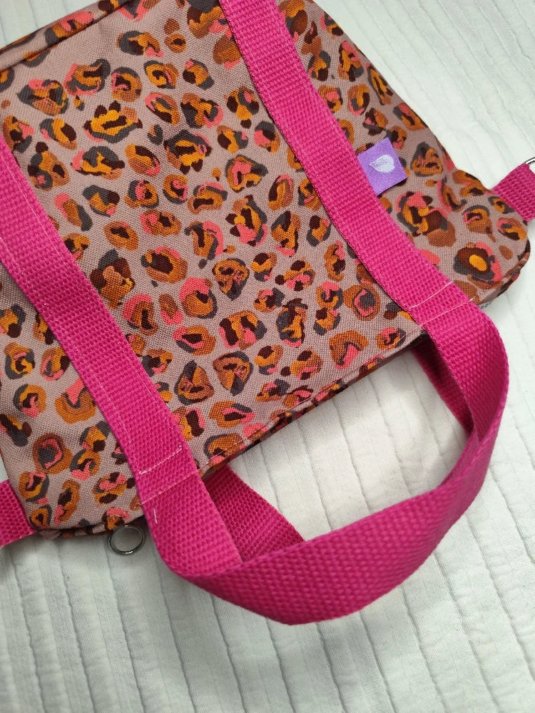 Bolso leopardo asas rosas