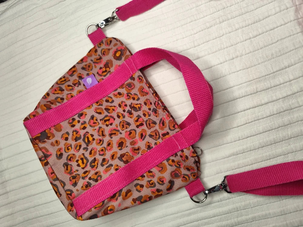 Bolso leopardo asas rosas