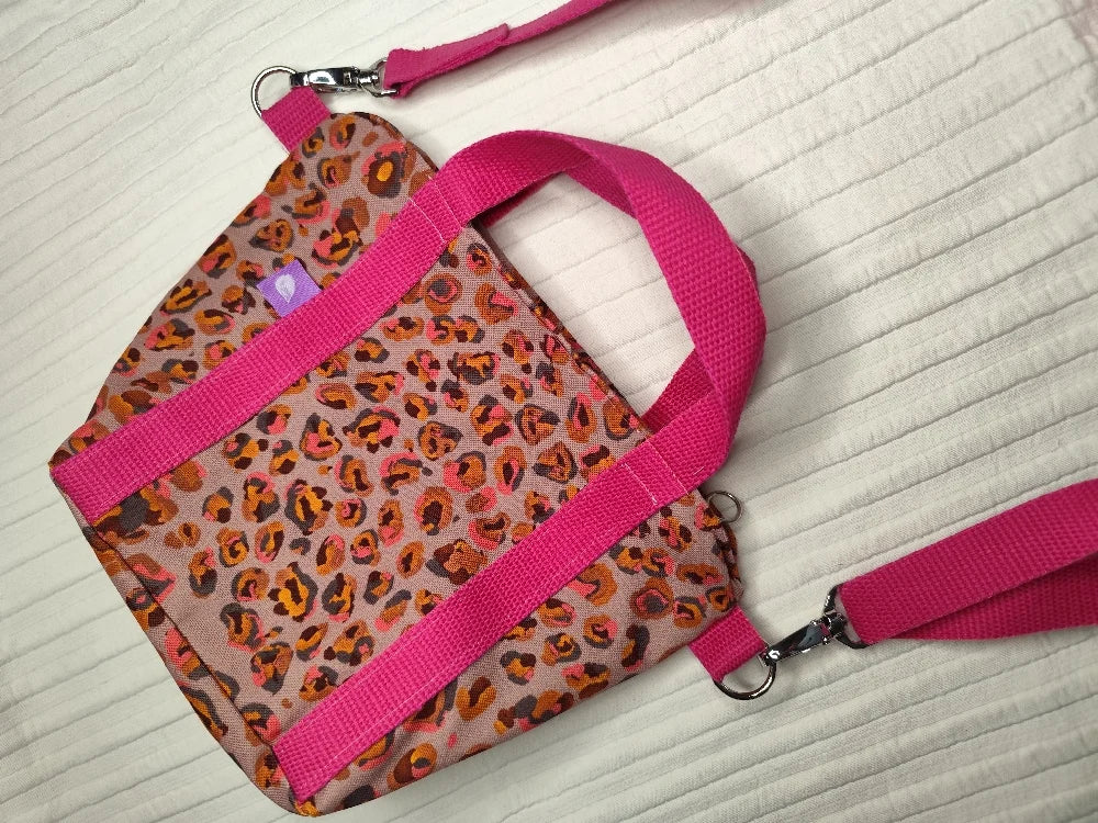 Bolso leopardo asas rosas