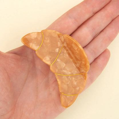 Pinza de Cruasán pal pelo